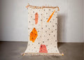 Handwoven White & Orange Moroccan Rug: Berber Wool Carpet